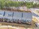 Townhome aerial view with gray roofing and private wooden decks overlooking wooded area at 1207 Corkery Ridge Ct, Cary, NC 27519
