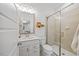 Bright bathroom featuring a glass shower, white vanity, and well-lit mirror providing a modern, clean aesthetic at 1207 Corkery Ridge Ct, Cary, NC 27519