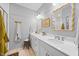 Bathroom featuring double sink vanity, framed mirrors, brushed nickel fixtures and lighting at 1207 Corkery Ridge Ct, Cary, NC 27519