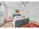 Inviting bedroom with a comfortable bed, neutral color palette, ceiling fan, and great natural light at 1207 Corkery Ridge Ct, Cary, NC 27519