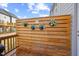 Private outdoor deck area featuring a stylish privacy wall with potted plants, creating a cozy retreat at 1207 Corkery Ridge Ct, Cary, NC 27519