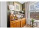 Bright dining area features a display cabinet, natural light, and hardwood floors at 1207 Corkery Ridge Ct, Cary, NC 27519