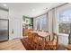 Bright dining area with hardwood floors, table, and views to back yard at 1207 Corkery Ridge Ct, Cary, NC 27519