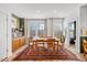 Bright dining room with hardwood floors, table, and view to back yard at 1207 Corkery Ridge Ct, Cary, NC 27519