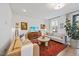 Comfortable living room featuring a sofa, TV, modern decor, and a plant adding a touch of nature at 1207 Corkery Ridge Ct, Cary, NC 27519