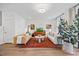Cozy living room featuring hardwood floors, decor, and plenty of natural light at 1207 Corkery Ridge Ct, Cary, NC 27519