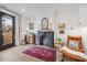 Cozy living room with stylish decor, fireplace, wooden accents, and a comfortable seating area near a window at 1207 Corkery Ridge Ct, Cary, NC 27519