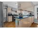 A kitchen island features an eat-in breakfast bar and stainless appliances at 1308 Drivers Cir, Rocky Mount, NC 27804