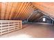 Large attic area with plywood flooring and exposed roof beams, offering versatile space at 1324 Emerson Cook Rd, Pittsboro, NC 27312