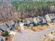 An aerial view of a two-story home in a residential neighborhood with mature trees and landscaping at 1416 Endgame Ct, Wake Forest, NC 27587