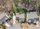 An aerial view shows the backyard, deck, and landscaping of this lovely home at 1416 Endgame Ct, Wake Forest, NC 27587