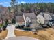 An aerial view of a two-story home with a well-manicured lawn and landscaping in a residential neighborhood at 1416 Endgame Ct, Wake Forest, NC 27587