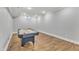 Finished basement features an air hockey table at 1416 Endgame Ct, Wake Forest, NC 27587