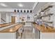 Finished basement features a bar area with seating, wine storage, and refrigeration at 1416 Endgame Ct, Wake Forest, NC 27587