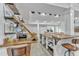 Basement bar featuring open shelves with glassware, and dining table at 1416 Endgame Ct, Wake Forest, NC 27587