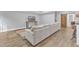 Finished basement with a large sectional sofa and tv at 1416 Endgame Ct, Wake Forest, NC 27587