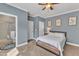 Comfortable bedroom with a ceiling fan, complemented by a well-lit bathroom at 1416 Endgame Ct, Wake Forest, NC 27587