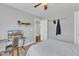Cozy bedroom featuring a large window, carpeted floors, a ceiling fan, and a desk and chair at 1416 Endgame Ct, Wake Forest, NC 27587