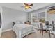 Comfortable bedroom featuring a large window, a ceiling fan, and carpeted floors at 1416 Endgame Ct, Wake Forest, NC 27587