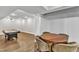 Finished basement includes a dining area with table and seating, as well as an air hockey table at 1416 Endgame Ct, Wake Forest, NC 27587