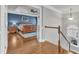 Hallway view leads into a bedroom and offers views of the stairway and outdoor scenery at 1416 Endgame Ct, Wake Forest, NC 27587