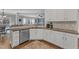 Stylish kitchen area boasts stainless steel appliances, and granite countertops at 1416 Endgame Ct, Wake Forest, NC 27587