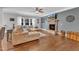 Cozy living room featuring a stone fireplace, plush seating, and hardwood flooring at 1416 Endgame Ct, Wake Forest, NC 27587