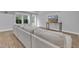 Finished basement with a large sectional sofa and tv at 1416 Endgame Ct, Wake Forest, NC 27587