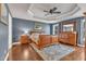 Spacious main bedroom featuring hardwood floors, detailed trey ceiling, and a large wooden dresser at 1416 Endgame Ct, Wake Forest, NC 27587