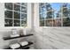 The window provides natural light to this bathroom which also features a floating shelf holding decorative items at 1708 Turtle Ridge Way, Raleigh, NC 27614