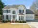 Stunning two-story traditional-style home with a two-car garage, manicured lawn, and classic architectural details at 1708 Turtle Ridge Way, Raleigh, NC 27614