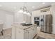 Spacious kitchen with granite counters, an island cooktop, and stainless steel appliances at 1708 Turtle Ridge Way, Raleigh, NC 27614