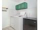 Functional laundry room featuring a washer, dryer, freezer, and subway tile walls at 18 Five Ponds Dr, Sanford, NC 27332