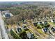 Community aerial view showcasing neighborhood layout, tree coverage, and proximity to amenities at 1818 Buxton Way, Burlington, NC 27215