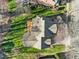 Aerial perspective of the house, displaying its roof, deck, landscaping, and backyard layout at 1818 Buxton Way, Burlington, NC 27215