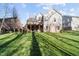 Expansive backyard features a multi-level deck and lush green lawn at 1818 Buxton Way, Burlington, NC 27215