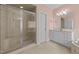 Bathroom featuring a glass-enclosed shower and a vanity with ample storage at 1818 Buxton Way, Burlington, NC 27215