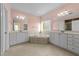 Elegant bathroom with dual vanities, soaking tub, and tile flooring at 1818 Buxton Way, Burlington, NC 27215