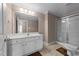 Bathroom featuring a white vanity, a well-lit mirror, and a glass-enclosed shower for a functional design at 1818 Buxton Way, Burlington, NC 27215