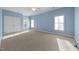 Bedroom featuring two large windows, double closet, and light blue walls at 1818 Buxton Way, Burlington, NC 27215