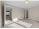 Bedroom showcasing light neutral colors with two doorways and overhead lighting at 1818 Buxton Way, Burlington, NC 27215