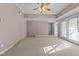 Bedroom featuring carpeted floors, neutral walls, french doors, and a ceiling fan at 1818 Buxton Way, Burlington, NC 27215
