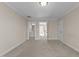 Carpeted bedroom features multiple doorways leading to the bathroom, hallway, and closet at 1818 Buxton Way, Burlington, NC 27215