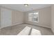 Bedroom featuring neutral walls, carpet, and a large window offering natural light at 1818 Buxton Way, Burlington, NC 27215