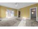 Bedroom with a ceiling fan and access to a private balcony and an en-suite bathroom at 1818 Buxton Way, Burlington, NC 27215