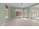 Bright dining area with views of the deck and access to the kitchen and other living spaces at 1818 Buxton Way, Burlington, NC 27215