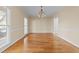 Spacious dining area with hardwood floors, ideal for entertaining guests at 1818 Buxton Way, Burlington, NC 27215