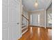 Inviting foyer with hardwood floors, natural light, and a staircase at 1818 Buxton Way, Burlington, NC 27215