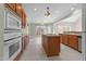 Spacious kitchen featuring a center island, stainless appliances, and access to the deck at 1818 Buxton Way, Burlington, NC 27215