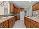 Kitchen with wood cabinets, light countertops, and stainless steel appliances at 1818 Buxton Way, Burlington, NC 27215
